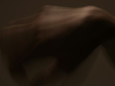 Blurred motion of hands in a relaxing gesture