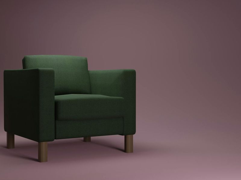 Minimalist room with a single chair and soft blue light